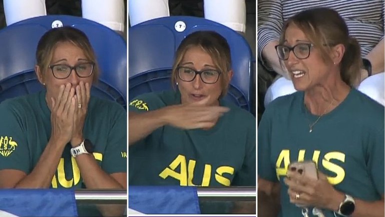 Hayley Lewis watches on as her son Kai Taylor claims a shock Commonwealth Games gold medal in the 200m freestyle.
