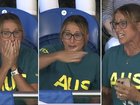 Hayley Lewis watches on as her son Kai Taylor claims a shock Commonwealth Games gold medal in the 200m freestyle.