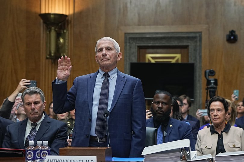 Dr. Anthony Fauci, former Director of the National Institute of Allergy and Infectious Diseases, prepares for the start of a Senate Homeland Security and Governmental Affairs Committee hearing.