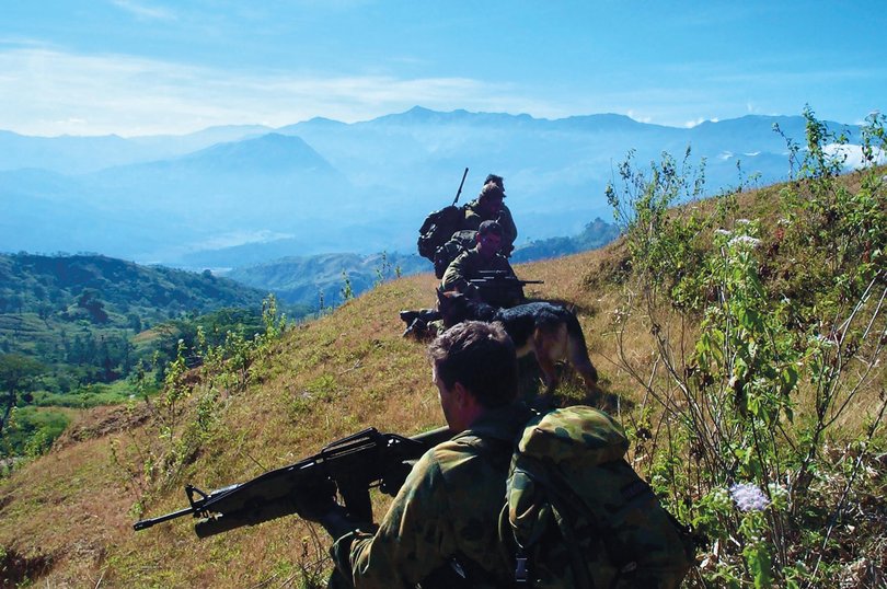 Commando Bram Connolly and his team waiting to be picked up by a helicopter from the mountains of East Timor in 2001. Credit: Bram Connolly Picture: Bram Connolly