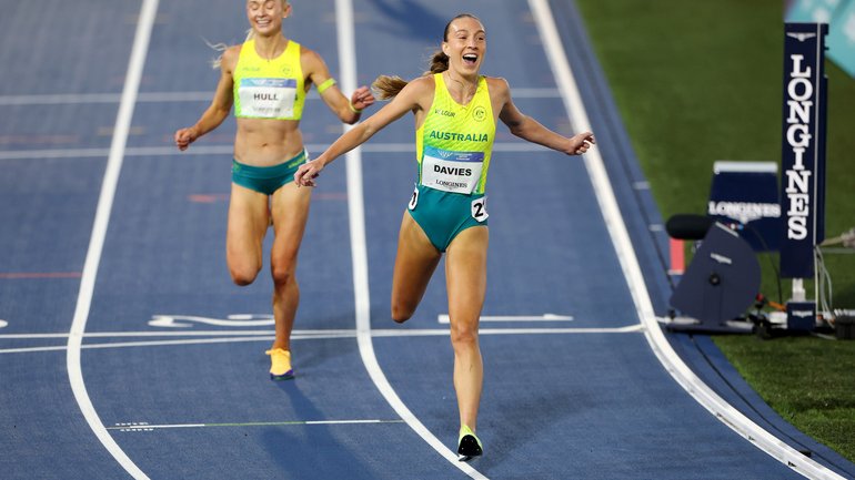 Rose Davies of Team Australia crosses the finish line to win the gold medal in the Women's 5000 Metres.