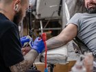 Forget polishing your resume — the latest way to nab a tech job? Get the company’s logo tattooed on your skin. 