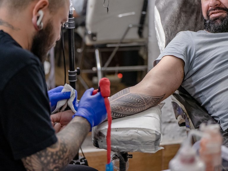 Forget polishing your resume — the latest way to nab a tech job? Get the company’s logo tattooed on your skin. 