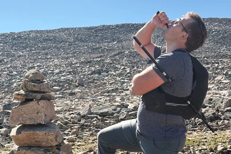 The hiker pictured descending the mountain with the metre long pole impaled through his torso.