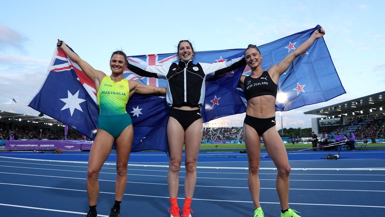Gold medalist Eliza McCartney of Team New Zealand, Silver medalist Nina Kennedy of Team Australia and Bronze medalist Imogen Ayris of Team New Zealand pose for a photo after competing in the Women's Pole Vault Final.
