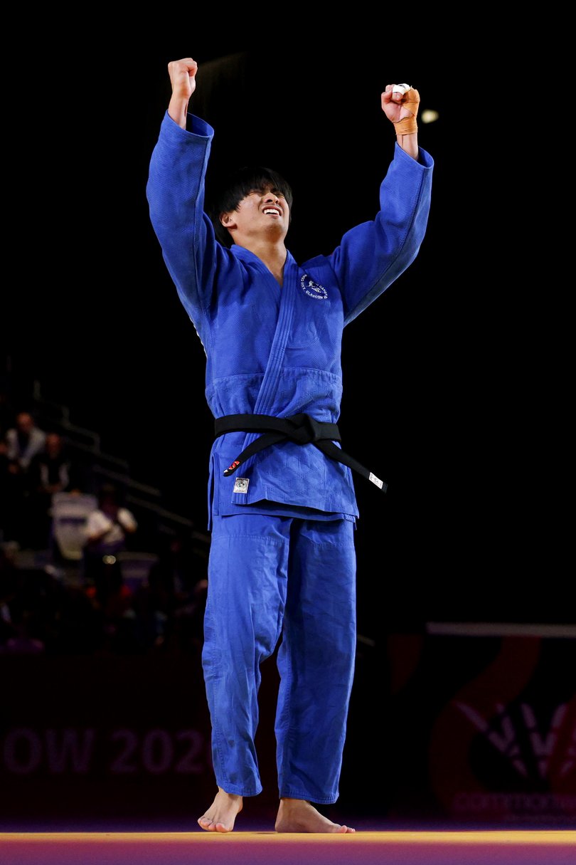 Keishin Ochi of Team Australia celebrates after winning the bronze medal.
