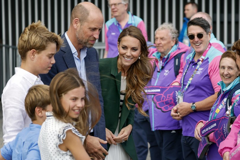 The royals greet the crowd.