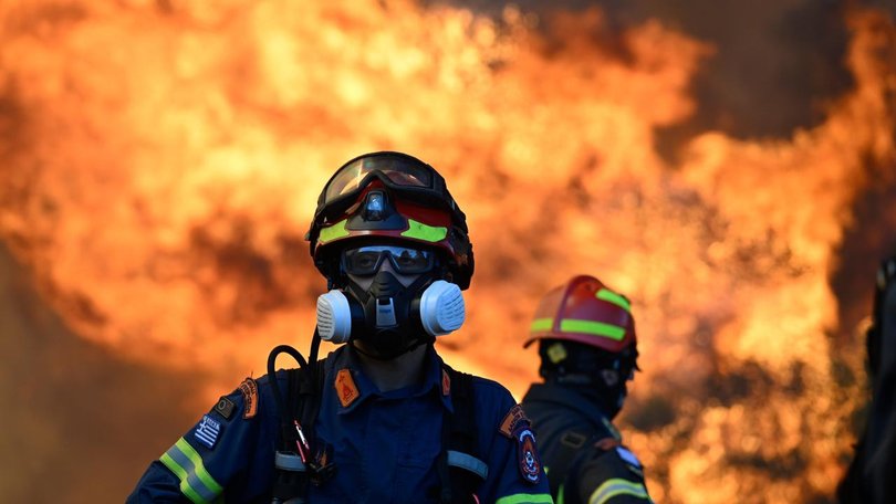 The flames from a major fire have spread to within a few kilometres of the coastal town of Megara.