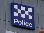 The 21-year-old was restrained by cabin crew until Australian Federal Police officers reached the arrivals gate. 