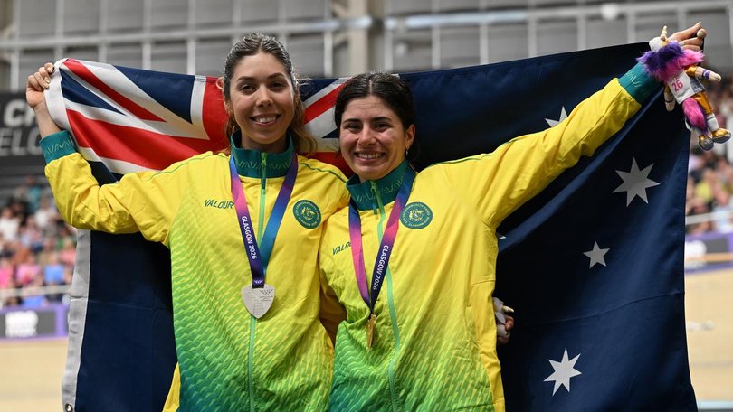 Medal-winning cyclists Georgia Baker (L) and Alyssa Polites fly the flag for the dominant Aussies.