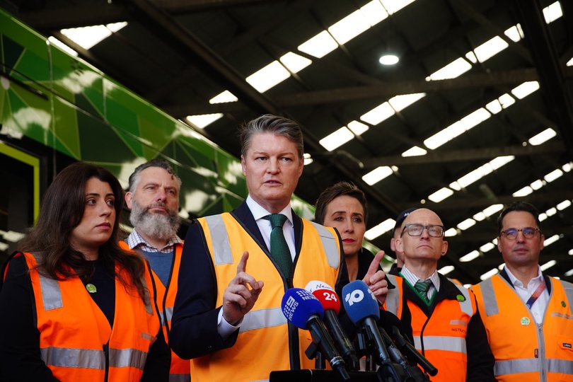 Premier Ben Carroll and Deputy Premier Gabrielle Williams visit the Essendon Tram Depot to make a media announcement.