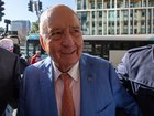 Alan Jones arrived at the court on Tuesday flanked by his lawyers. 