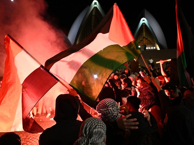 Flares were lit at a Free Palestine rally at the Sydney Opera House on October 9, 2023.