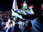 Participants of a Free Palestine rally desecrate an Israeli flag outside the Sydney Opera House on October 9, 2023.