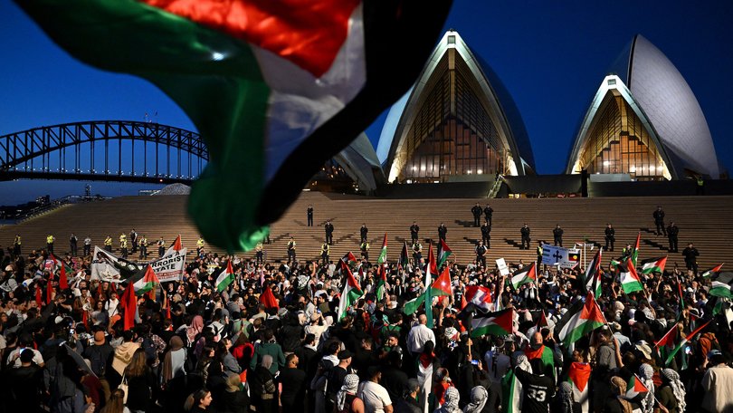 Participants of a Free Palestine rally react outside the Sydney Opera House in Sydney, Monday, October 9, 2023. Israel has pounded the Palestinian enclave of Gaza, killing hundreds of people in retaliation for one of the bloodiest attacks in its history when Islamist group Hamas killed 700 Israelis and abducted dozens more.