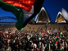 Participants of a Free Palestine rally react outside the Sydney Opera House in Sydney, Monday, October 9, 2023. Israel has pounded the Palestinian enclave of Gaza, killing hundreds of people in retaliation for one of the bloodiest attacks in its history when Islamist group Hamas killed 700 Israelis and abducted dozens more.