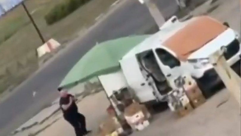 Footage shared by Ukrainian police shows the drone pursuing a man around a van being used as a street stand before exploding as he dives for cover behind the vehicle.