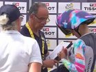 Officials conduct chest checks at the Tour de France Femmes.