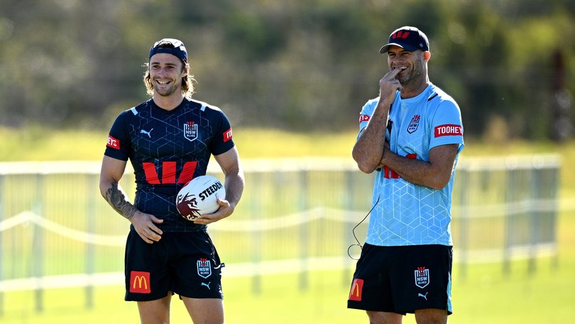 Nicho Hynes (left) and Matt King watch on during a NSW Blues training session in 2024.