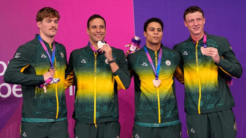 Le Clos (second from left) learned he had lost his home soon after winning relay bronze.