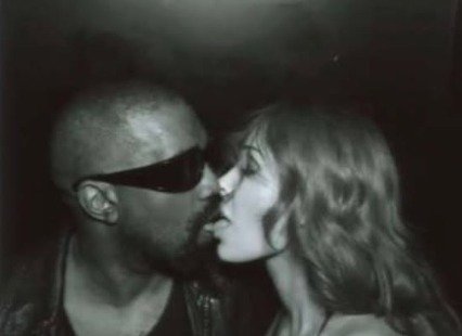 Censori, 31, is featured next to her controversial rapper husband Kanye, and the pair are pictured provocatively tongue kissing in front of the camera.