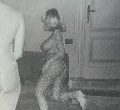 Censori is snapped wearing nothing but a fishnet body stocking and a blonde wig while leaning on a couch in subsequent stories. 