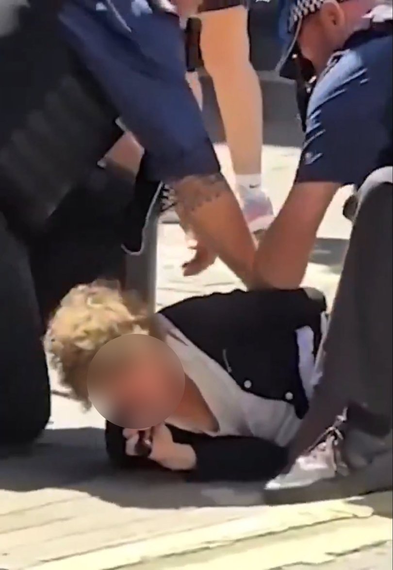 Police officers arrested a woman after four people were stabbed in central London.