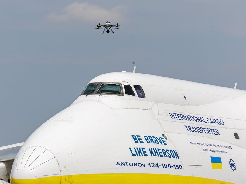 A police drone takes off next to Ukrainian Antonov cargo plane at Leipzig/Halle Airport.