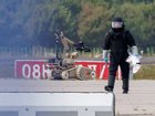 An investigator works with a robot capable of defusing explosives near a Ukrainian Antonov cargo plane at Leipzig/Halle Airport in Germany. 
