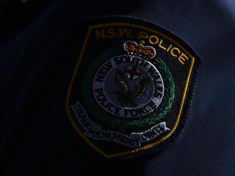 A serving NSW Police officer has been charged after allegedly assaulting a woman known to her and sending threatening messages while on duty.