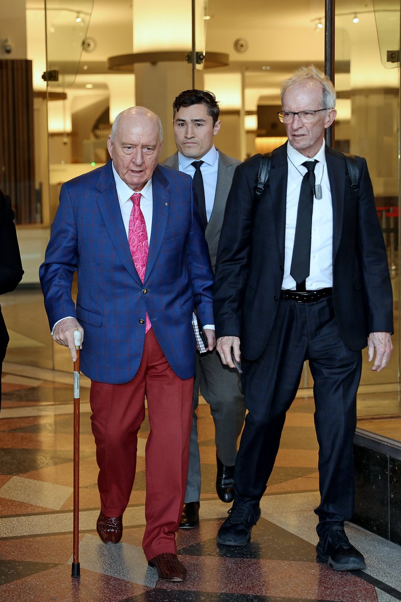 Alan Jones with Lawyers Brian Wrench and Chris Murphy, leaves Downing Centre Court after the fourth day of his trial on indecent assault charges.