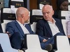 Gianni Infantino, centre, speaks to FIFA secretary general Mattias Grafstrom, left, in Morocco. 
