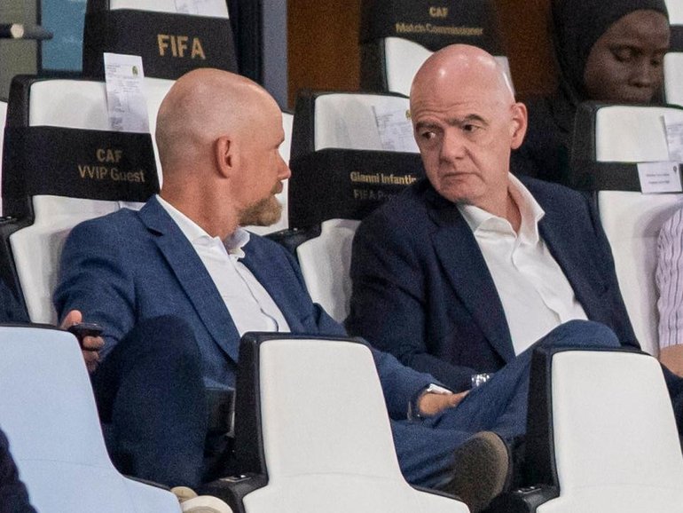 Gianni Infantino, centre, speaks to FIFA secretary general Mattias Grafstrom, left, in Morocco. 
