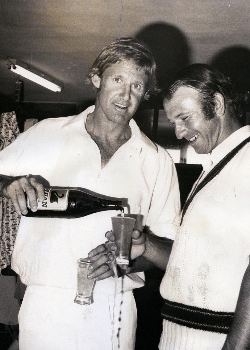 Top-scorer Ross Edwards pours a celebratory beer for his fellow Australian century-maker Doug Walters.