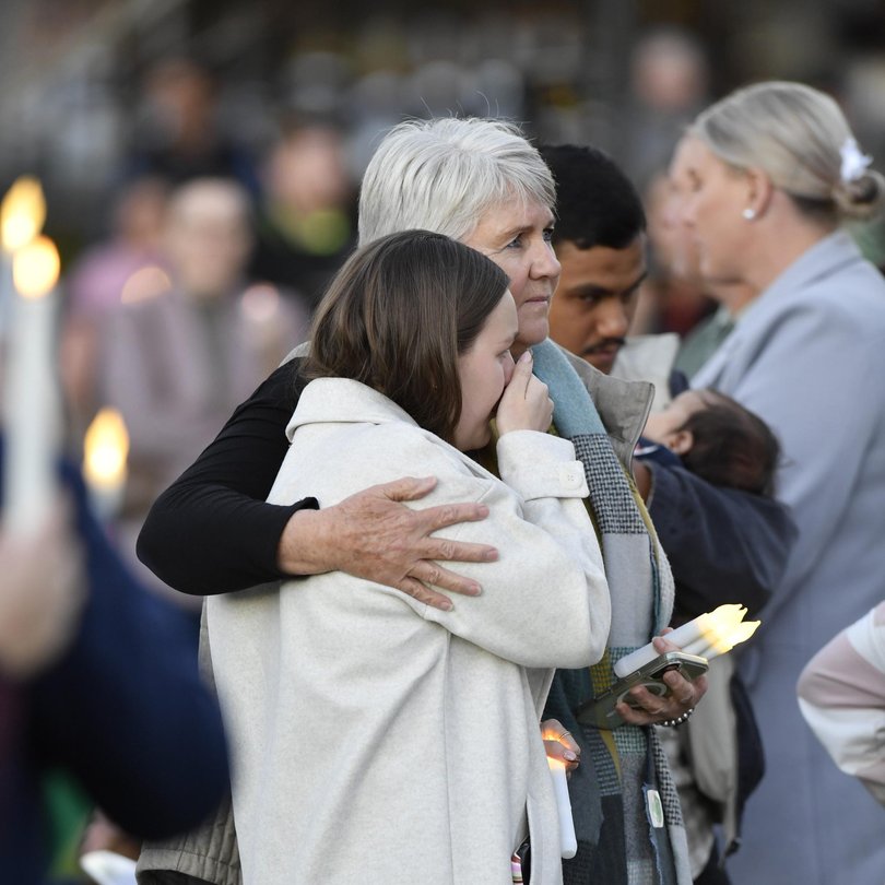 Family members at a community candlelight vigil in remembrance of Ms Armstrong on July 24. Picture: Kevin Farmer