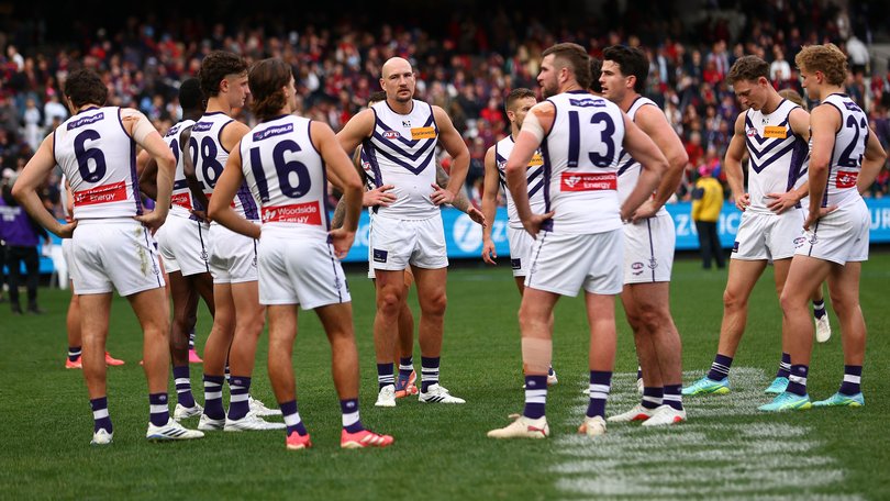 The Dockers look dejected following the round 22 AFL match between Melbourne Demons and Fremantle Dockers.