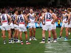 The Dockers look dejected following the round 22 AFL match between Melbourne Demons and Fremantle Dockers.