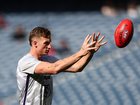 Josh Treacy of the Dockers warms up.