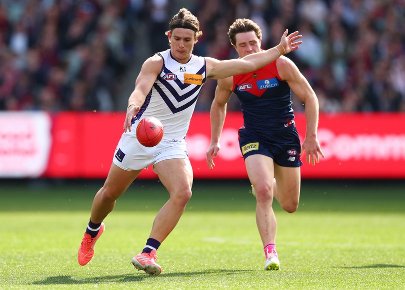 MELBOURNE, AUSTRALIA - AUGUST 08: Caleb Serong of the Dockers kicks the ball during the round 22 AFL match between Melbourne Demons and Fremantle Dockers at Melbourne Cricket Ground, on August 08, 2026, in Melbourne, Australia. (Photo by Daniel Pockett/Getty Images)