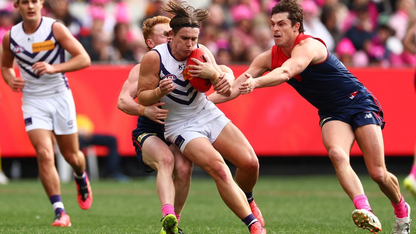 MELBOURNE, AUSTRALIA - AUGUST 08: Caleb Serong of the Dockers is tackled by Jake Bowey of the Demons during the round 22 AFL match between Melbourne Demons and Fremantle Dockers at Melbourne Cricket Ground, on August 08, 2026, in Melbourne, Australia. (Photo by Daniel Pockett/Getty Images)