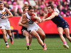Caleb Serong of the Dockers is tackled by Jake Bowey of the Demons.