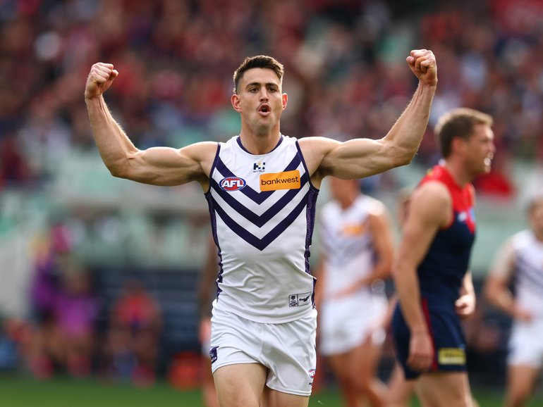 Patrick Voss of the Dockers celebrates kicking a goal.