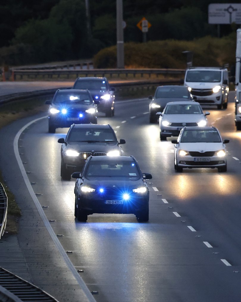 Garda vehicles travel on the M7 Motorway at Rathcoole after leaving the Criminal Courts of Justice in Dublin, where Daniel Kinahan was remanded in custody charged with directing an organised crime group, after being extradited from Dubai.
