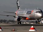Authorities are demanding answers after a near-miss involving a Jetstar plane. (Joel Carrett/AAP PHOTOS)