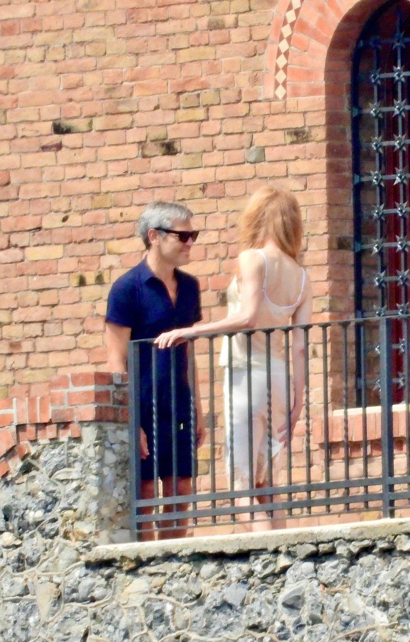 Nicole Kidman shares a farewell with a mystery man outside the suite of her Italian Hotel.