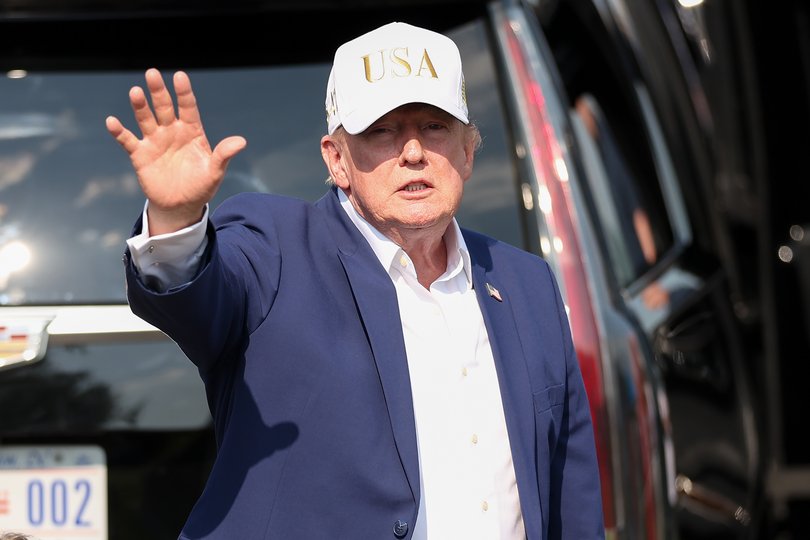 Donald Trump waves to attendees during day four of LIV Golf New York at Trump National Golf Club on Sunday.