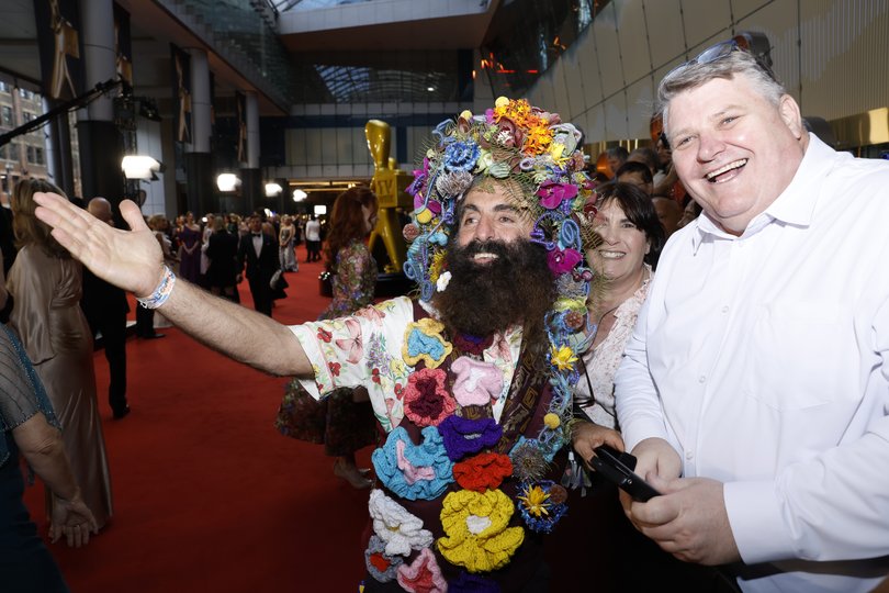 Costa mingles on the red carpet.