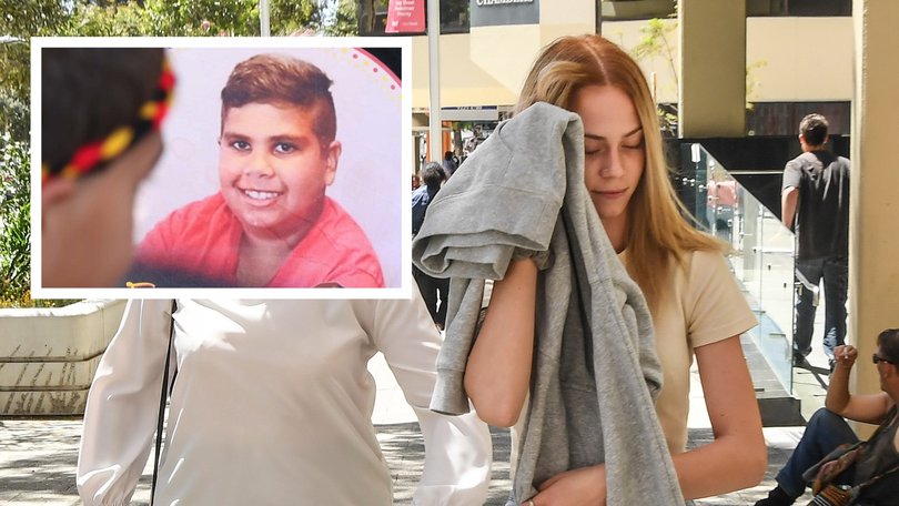 A woman acquitted of murdering an Indigenous teenager who was chased into bushland and beaten to death with a metal pole has returned to court.