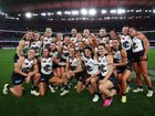 blues players pose for a photo during the round one AFLW match between St Kilda Saints and Carlton Blues at Marvel Stadium, on August 9.