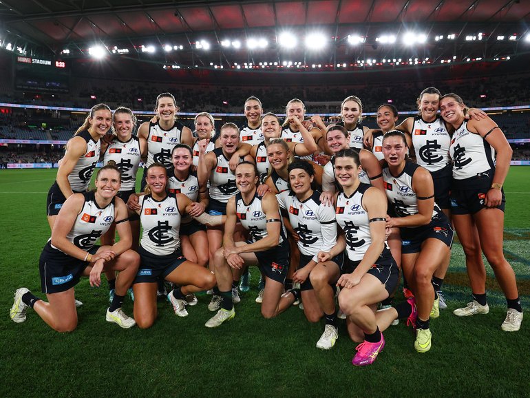 blues players pose for a photo during the round one AFLW match between St Kilda Saints and Carlton Blues at Marvel Stadium, on August 9.